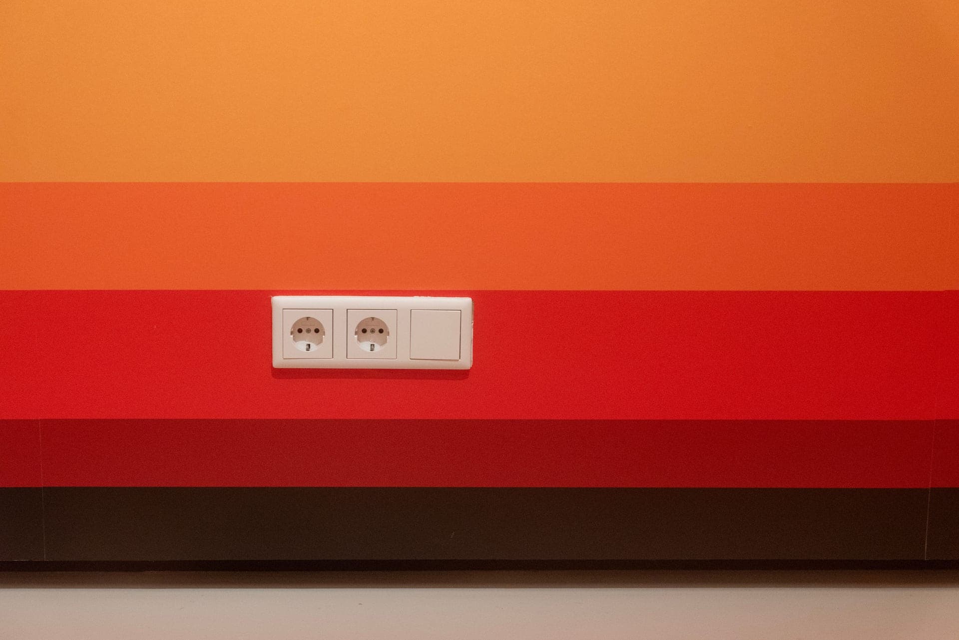 Plug-in carbon monoxide detector with a digital display on a hallway wall