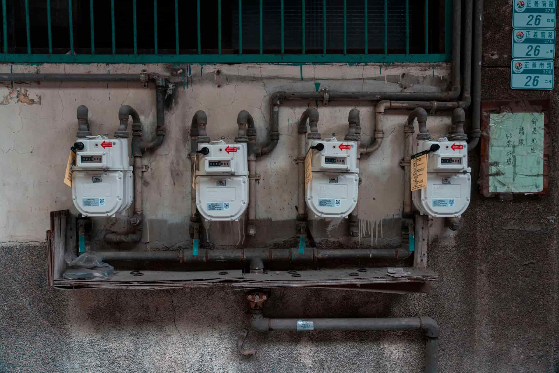 Illustrative photo of a wall-mounted carbon monoxide monitor showing a low parts-per-million reading